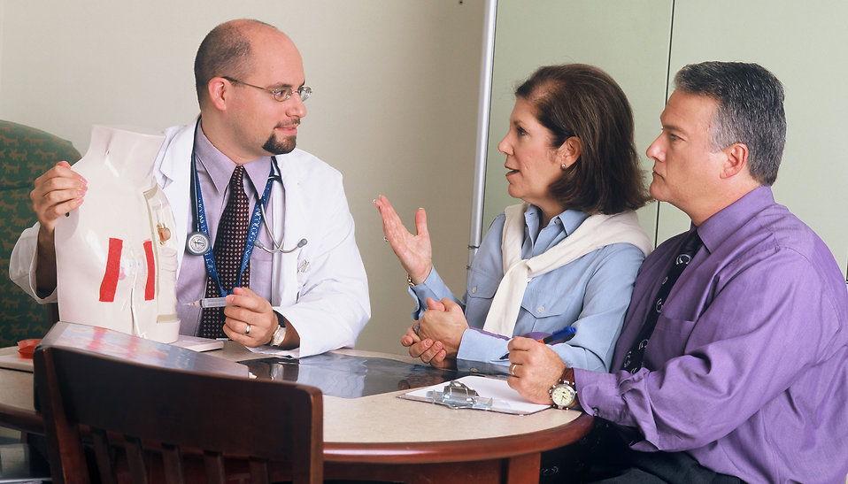 Doctor talking to patients